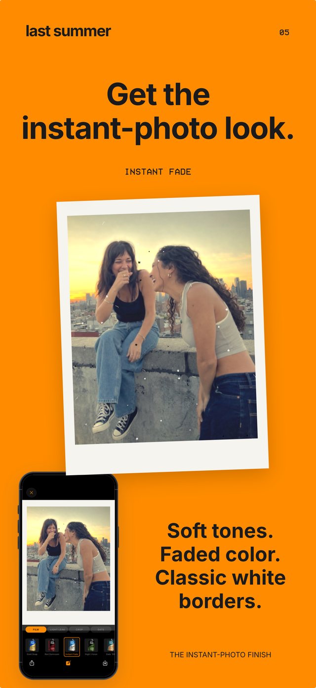 Two friends laughing on a rooftop at sunset in an Instant Fade white border